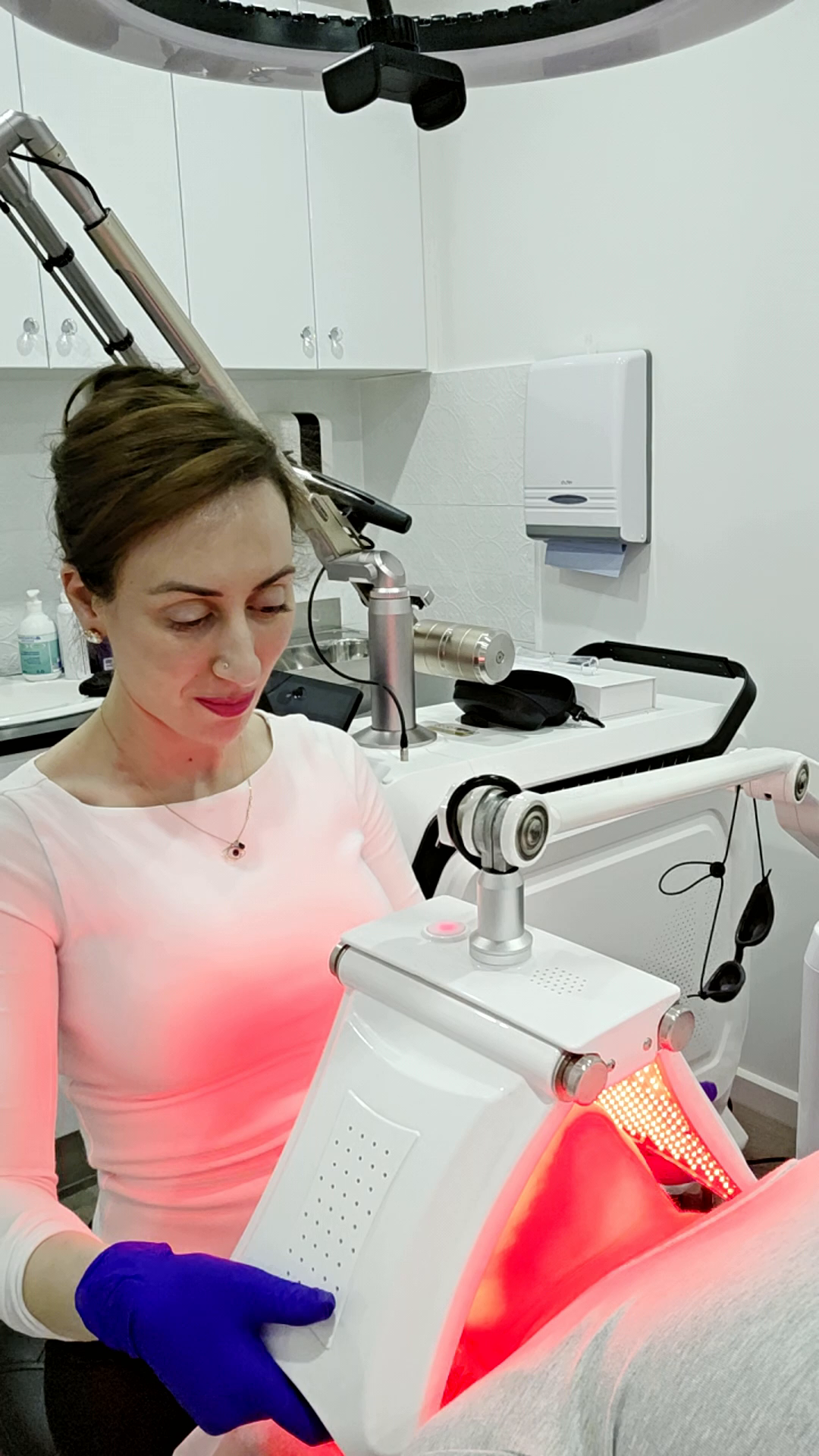 Illuminated LED light therapy machine at Beautique Artistry